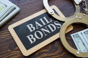 Plate Bail bonds and handcuffs on it