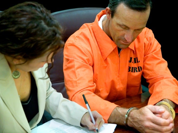 Lawyer with her defendant in the legal system